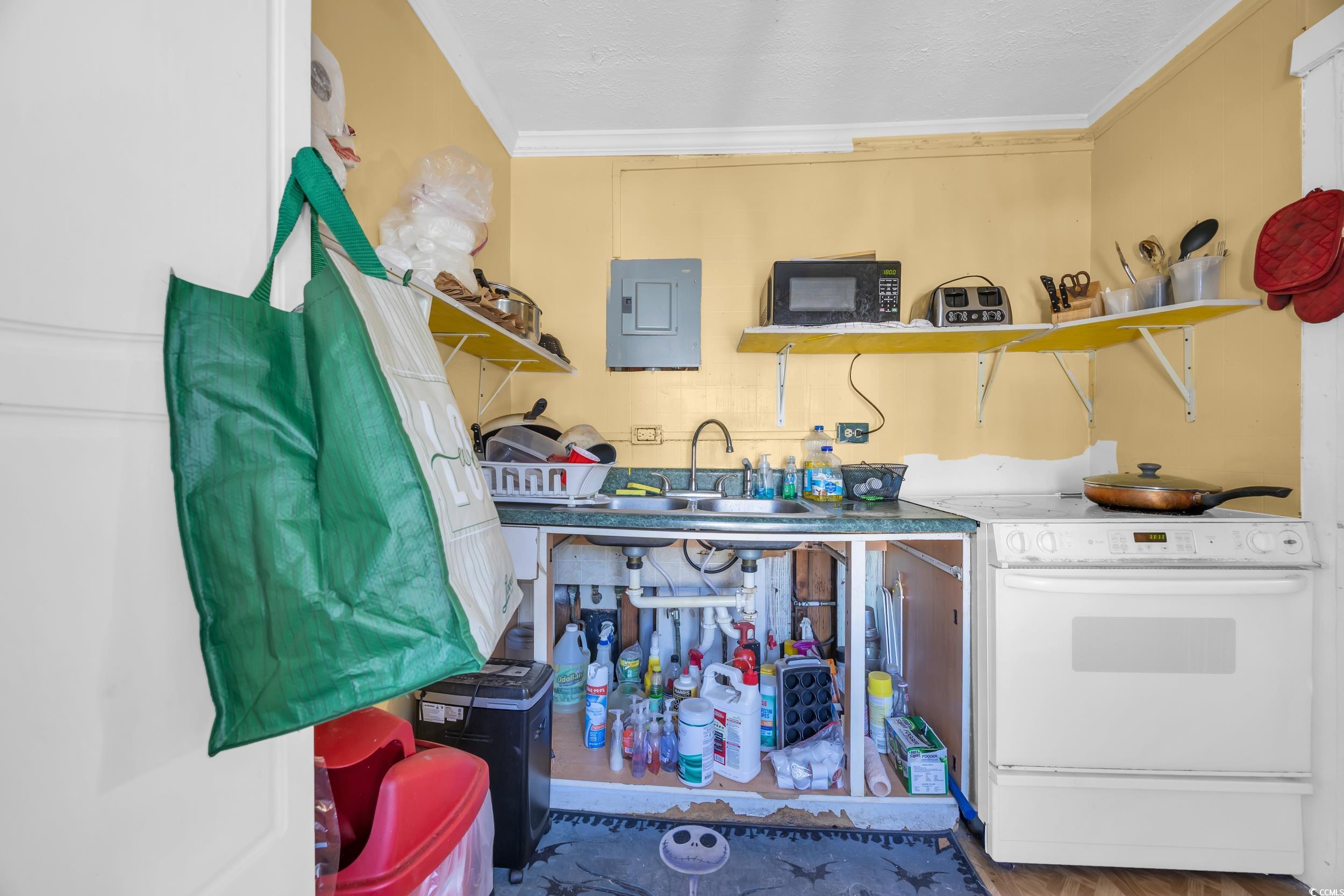 1616 Perrin Drive North Myrtle Beach, SC 29582 - Photo 35 of 40 Kitchen featuring electric stove, open shelves, black microwave, electric panel, and ornamental molding
