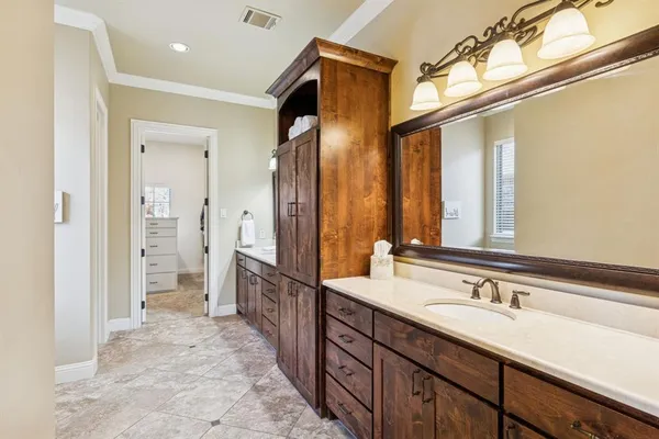 a spacious bathroom with a double vanity sink mirror and shower