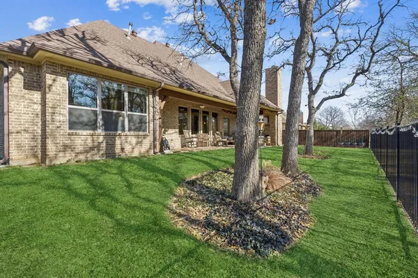 an aerial view of a house with outdoor space