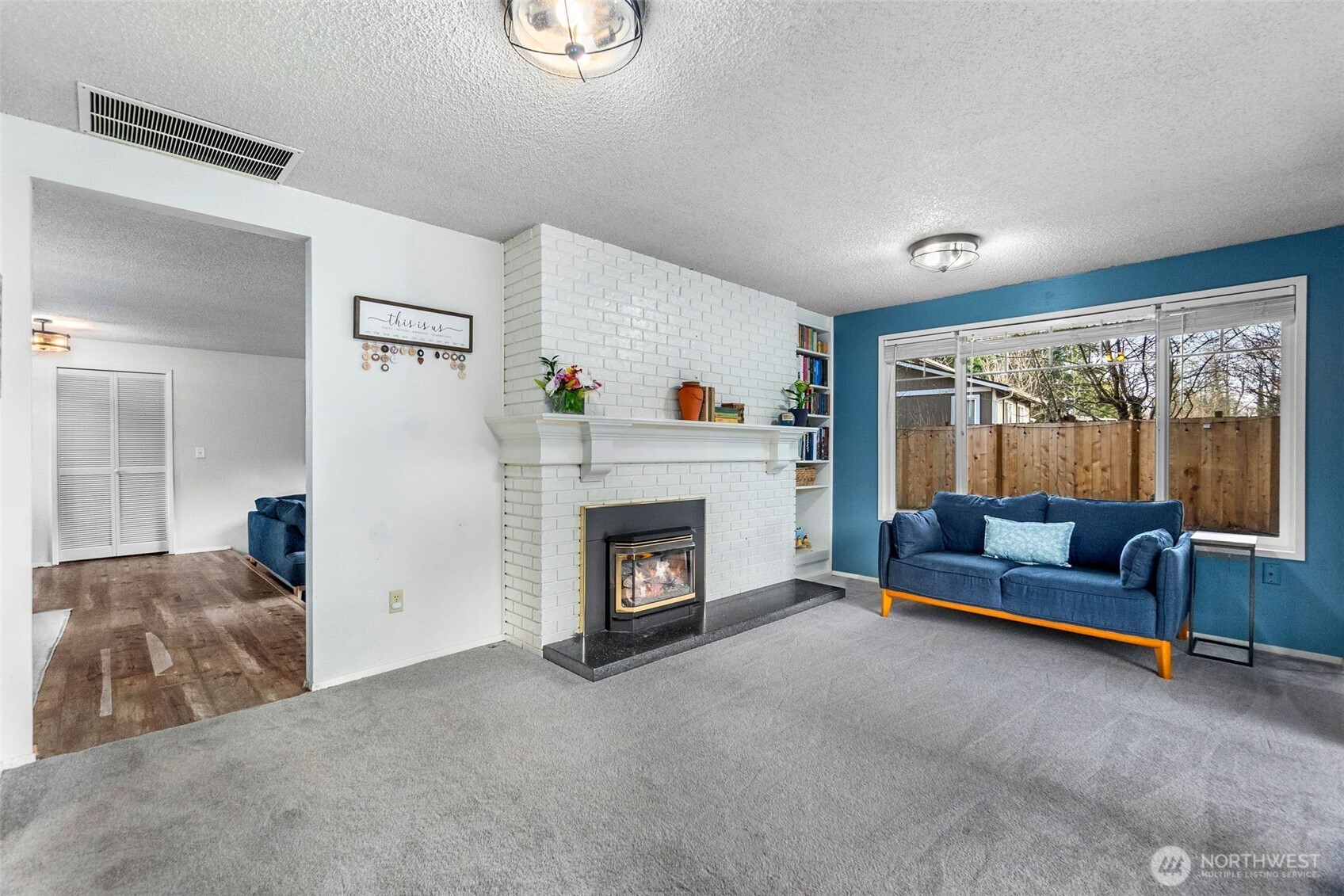 3102 60th Loop Southeast Olympia, WA 98501 - Photo 12 of 40 a living room with furniture and a fireplace