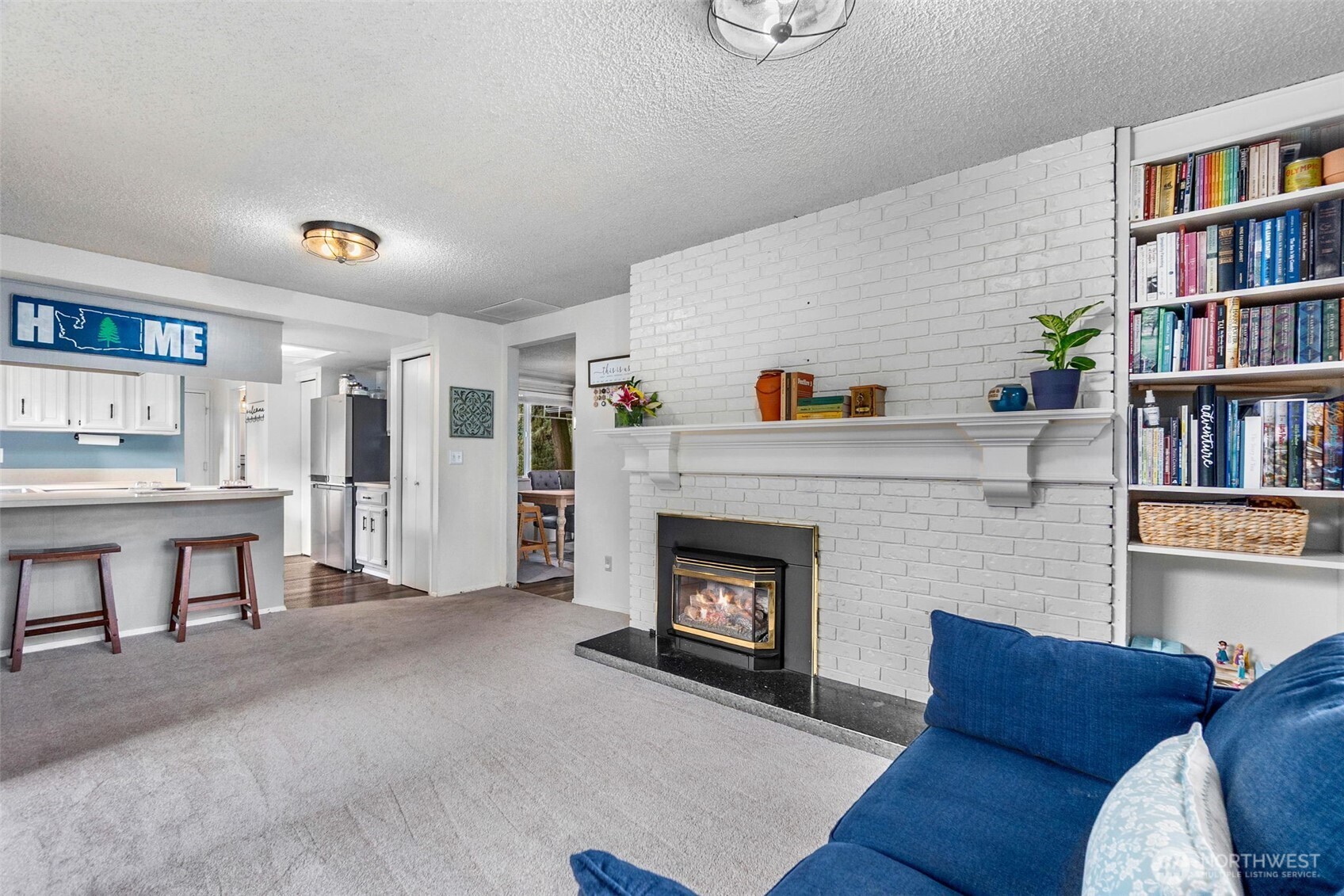 3102 60th Loop Southeast Olympia, WA 98501 - Photo 13 of 40 a living room with furniture and a fireplace