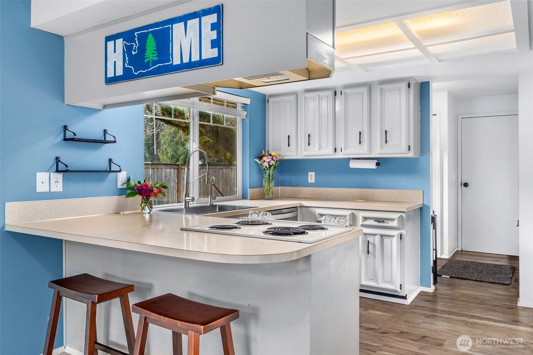 3102 60th Loop Southeast Olympia, WA 98501 - Photo 15 of 40 a kitchen with stainless steel appliances granite countertop a stove a sink and a refrigerator