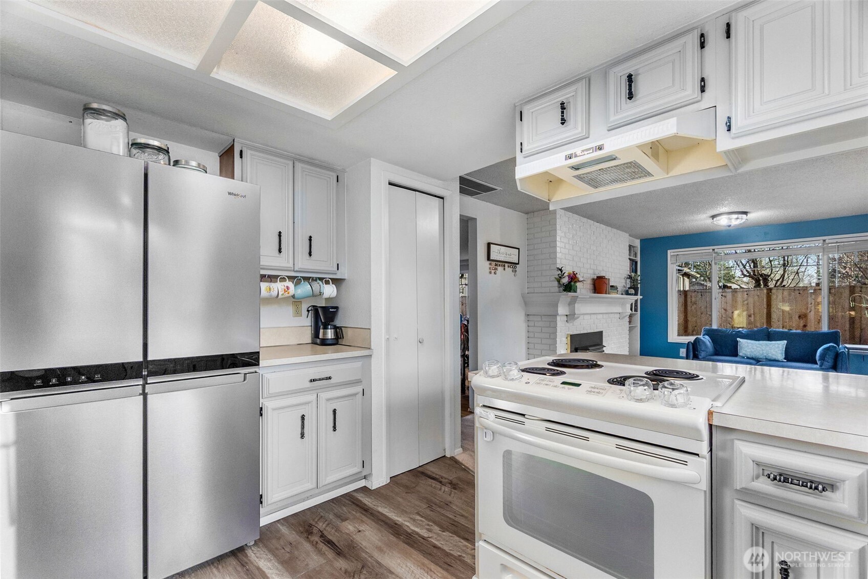 3102 60th Loop Southeast Olympia, WA 98501 - Photo 18 of 40 a kitchen with cabinets and stainless steel appliances