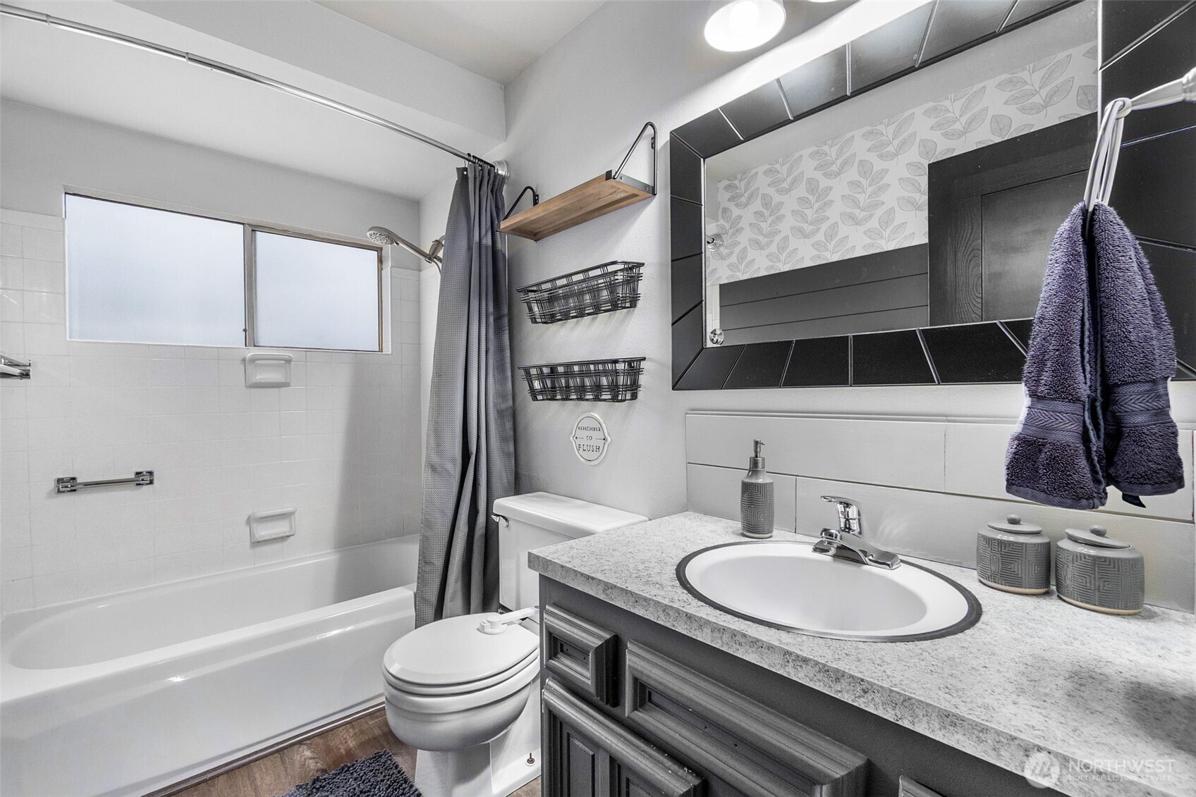 3102 60th Loop Southeast Olympia, WA 98501 - Photo 25 of 40 a bathroom with a granite countertop sink toilet and shower