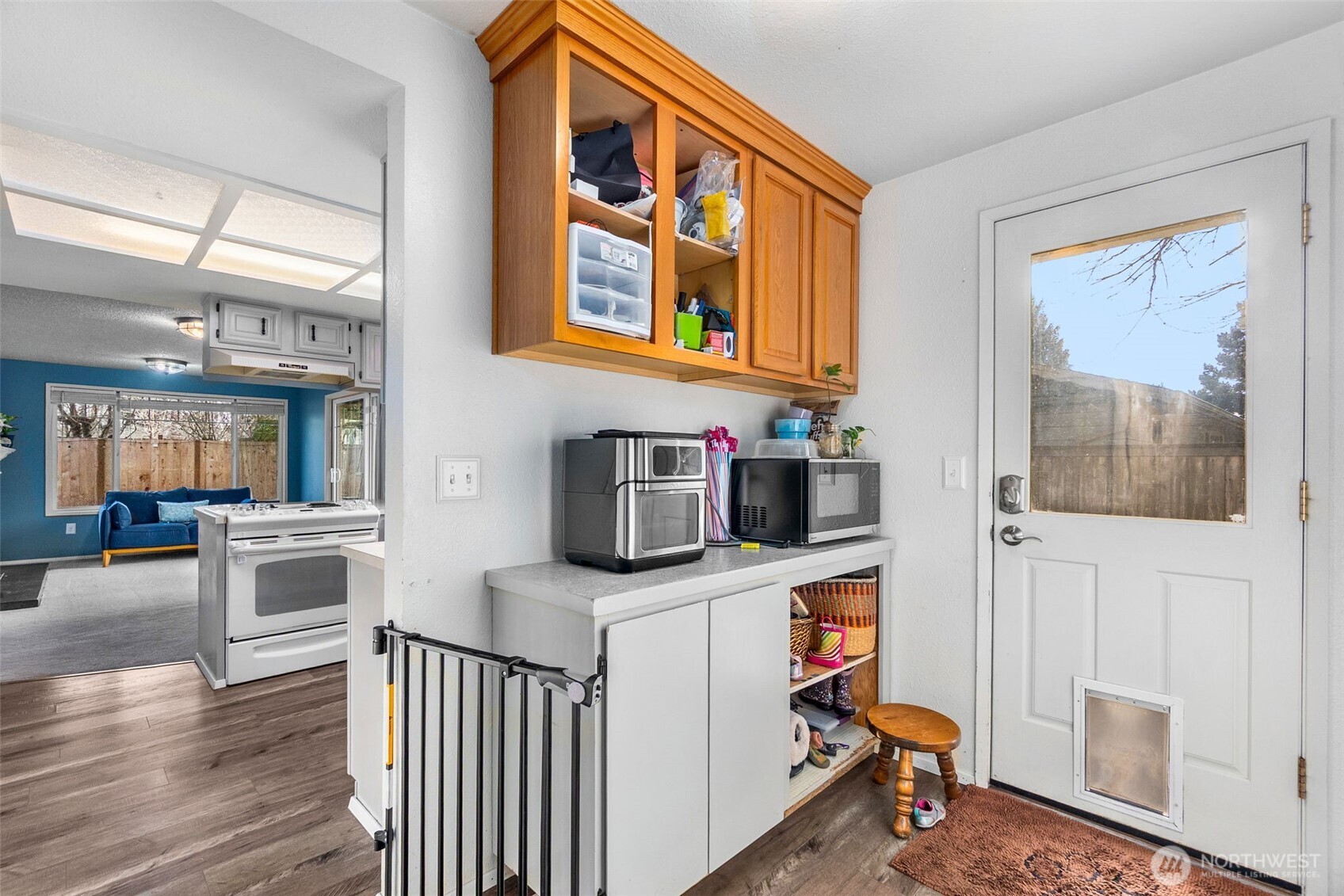 3102 60th Loop Southeast Olympia, WA 98501 - Photo 29 of 40 a very nice looking living room with stainless steel appliances wooden floor and a window