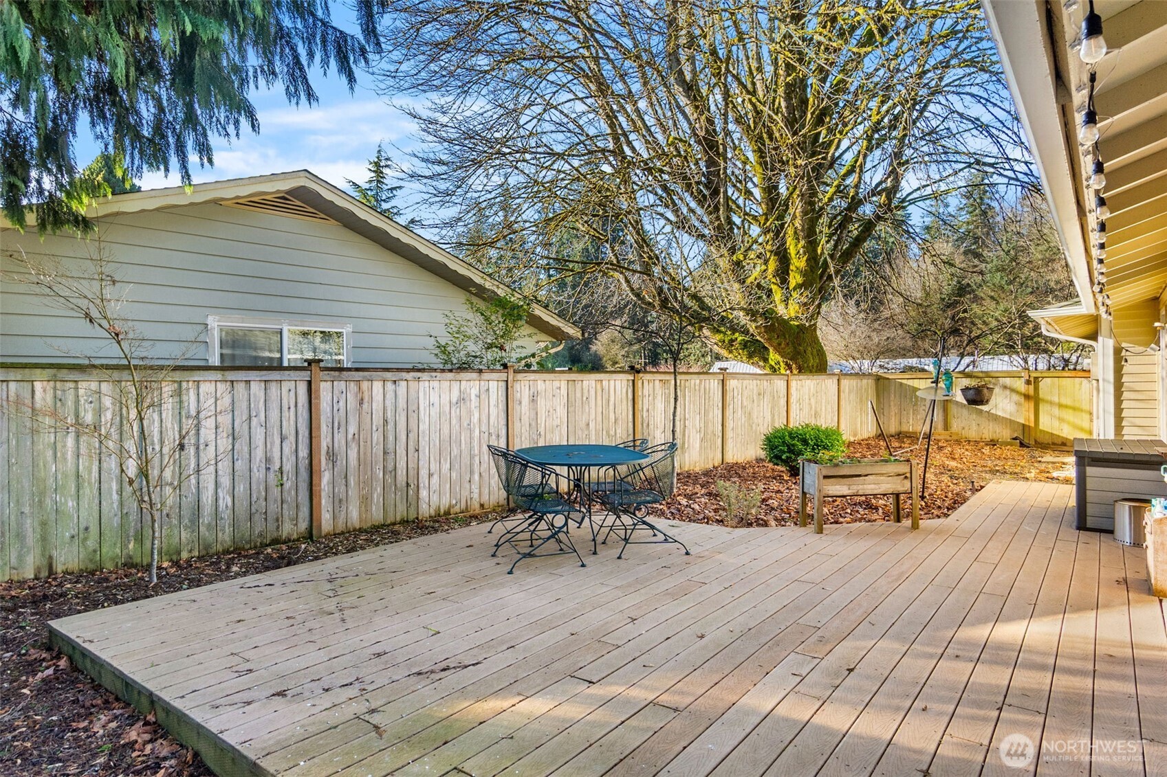 3102 60th Loop Southeast Olympia, WA 98501 - Photo 31 of 40 a view of a wooden deck with chairs