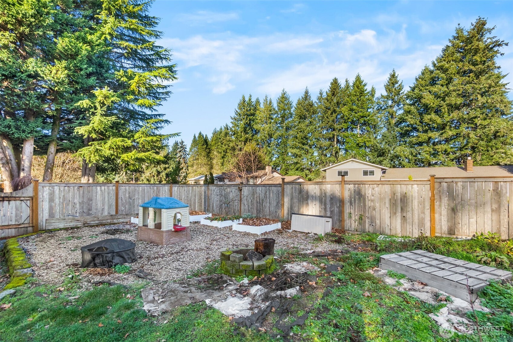 3102 60th Loop Southeast Olympia, WA 98501 - Photo 33 of 40 a view of a backyard with a small garden
