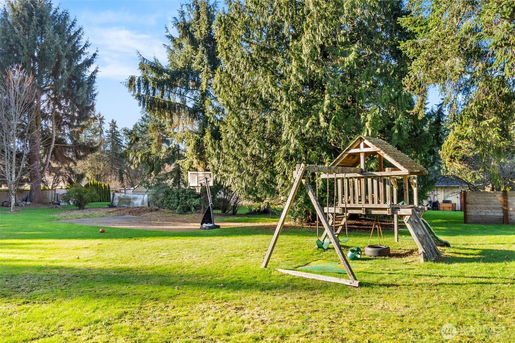 3102 60th Loop Southeast Olympia, WA 98501 - Photo 37 of 40 a view of a house with a swimming pool and a child park