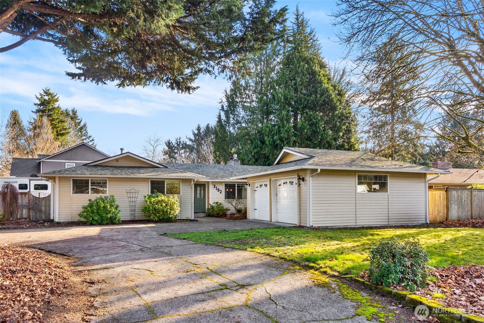 3102 60th Loop Southeast Olympia, WA 98501 - Photo 40 of 40 a front view of a house with a garden