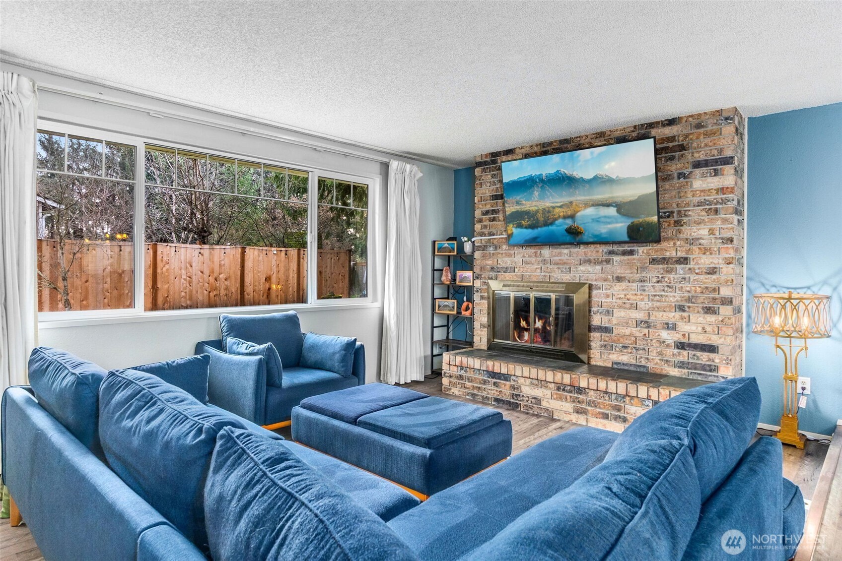 3102 60th Loop Southeast Olympia, WA 98501 - Photo 5 of 40 a living room with furniture and a fireplace