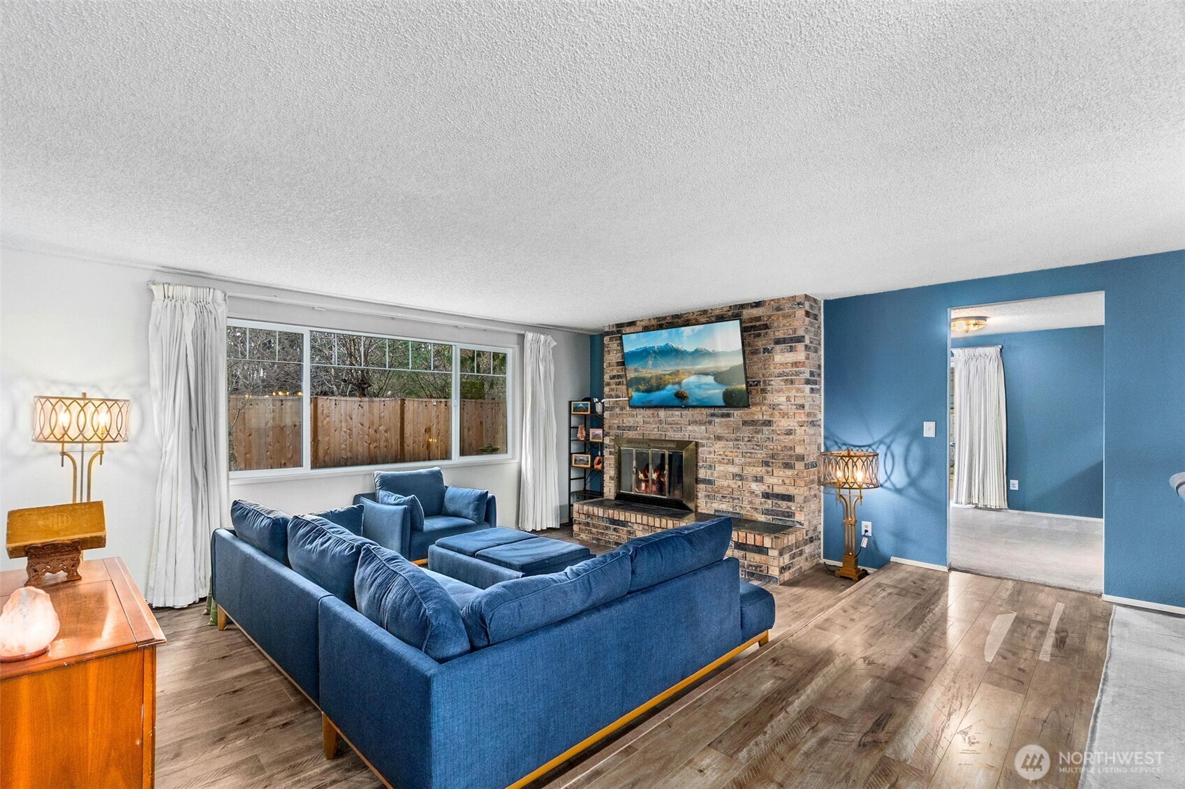 3102 60th Loop Southeast Olympia, WA 98501 - Photo 7 of 40 a living room with furniture and a fireplace