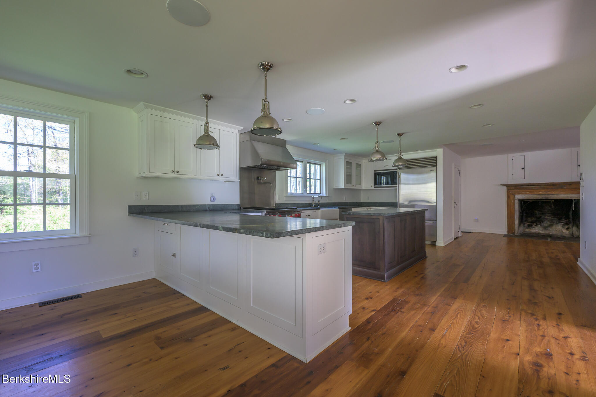 304 Hickey Hill Road Sheffield, MA 01257 - Photo 17 of 60 a kitchen with stainless steel appliances granite countertop a sink cabinets and wooden floor