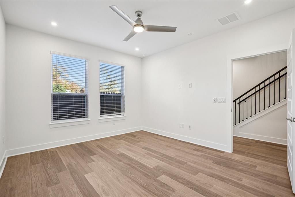 200 West 56th Street, Unit 8102 Austin, TX 78751 - Photo 9 of 13 a view of an empty room with wooden floor and a window