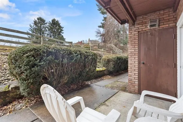 a view of balcony with furniture