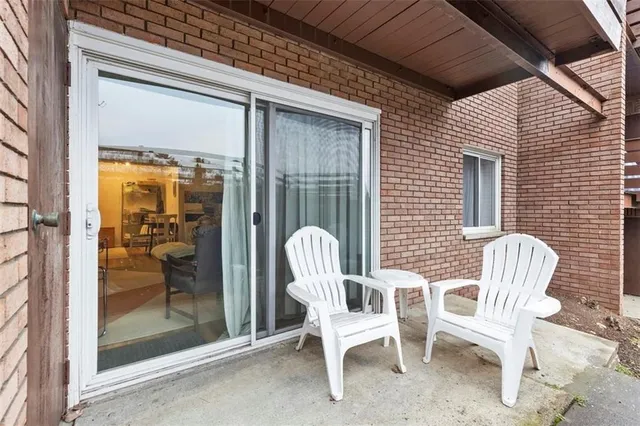 a view of a two chairs in the porch