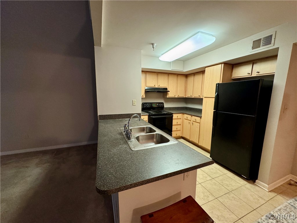 604 Bristol Village Drive, Unit 303 Midlothian, VA 23114 - Photo 11 of 18 a kitchen with a refrigerator a sink and a stove
