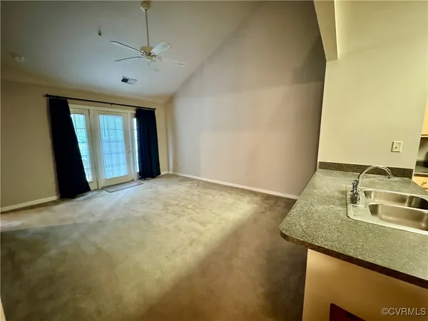 a view of a kitchen with a sink cabinets and a window