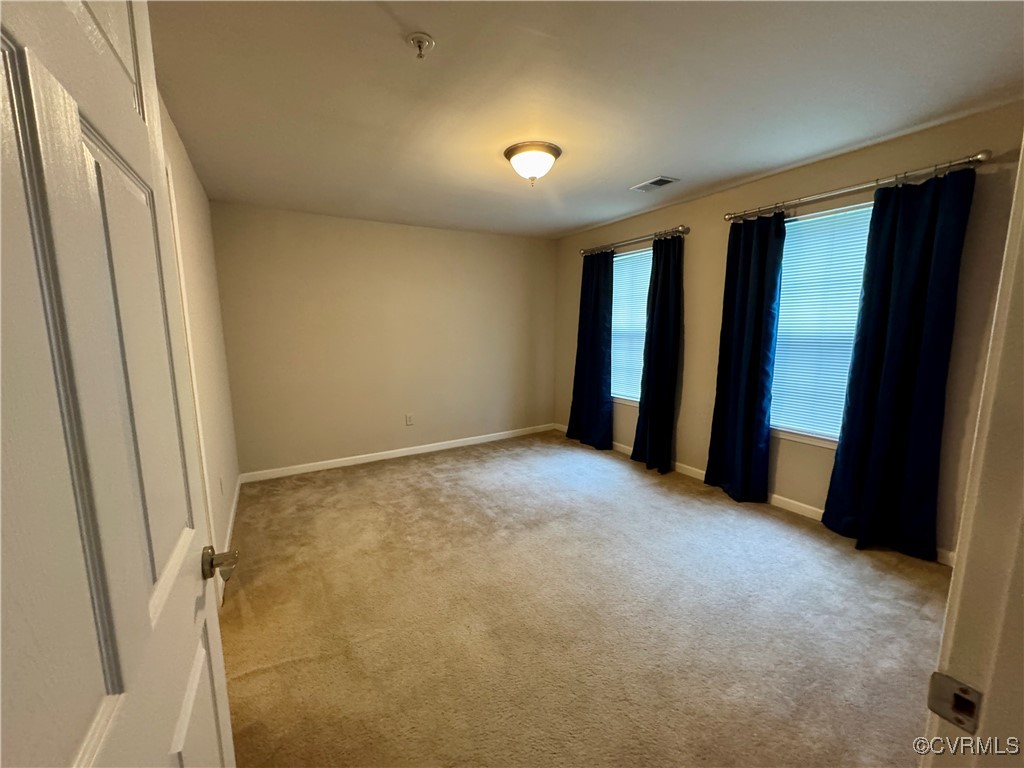 604 Bristol Village Drive, Unit 303 Midlothian, VA 23114 - Photo 6 of 18 a view of an empty room with a window
