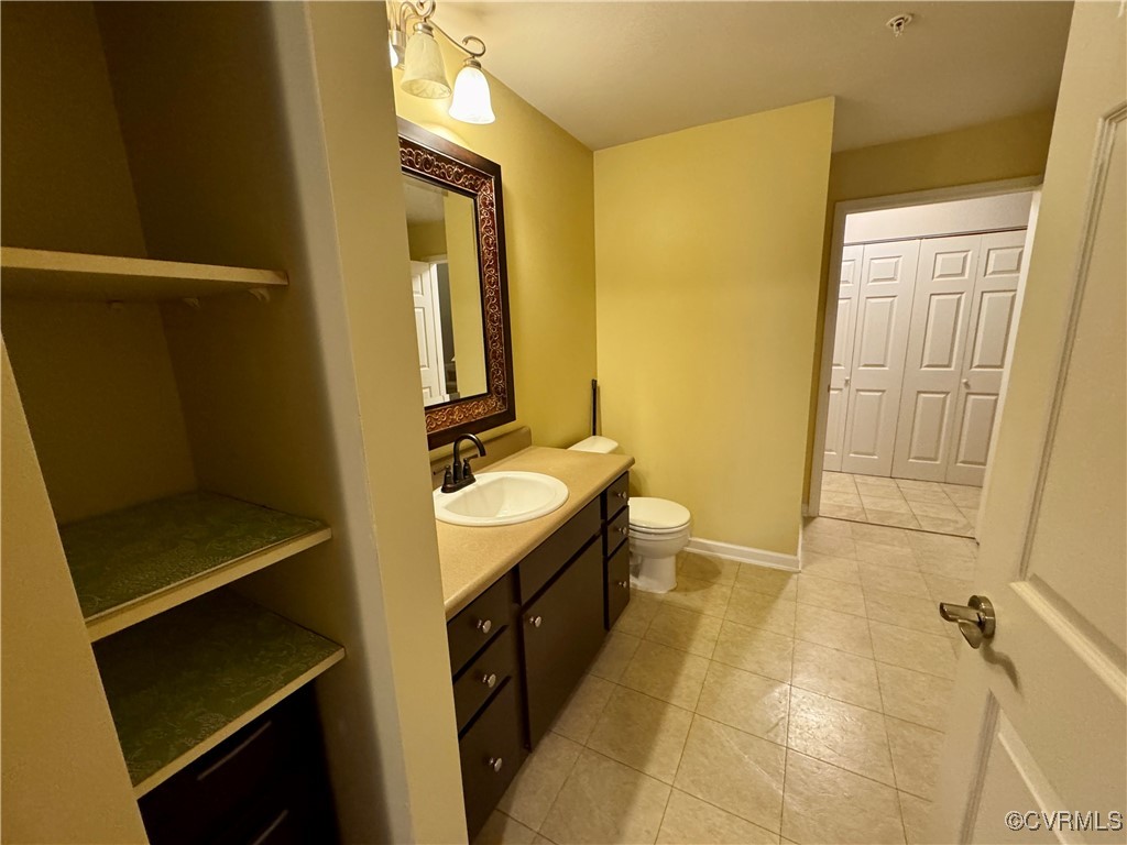 604 Bristol Village Drive, Unit 303 Midlothian, VA 23114 - Photo 7 of 18 a bathroom with a granite countertop sink toilet and shower