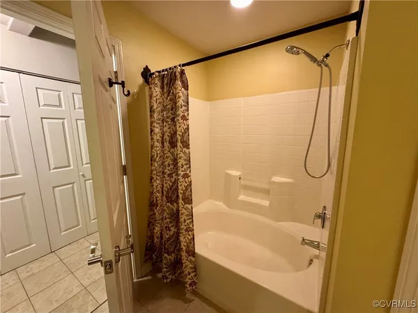 a bathroom with a shower and a tub