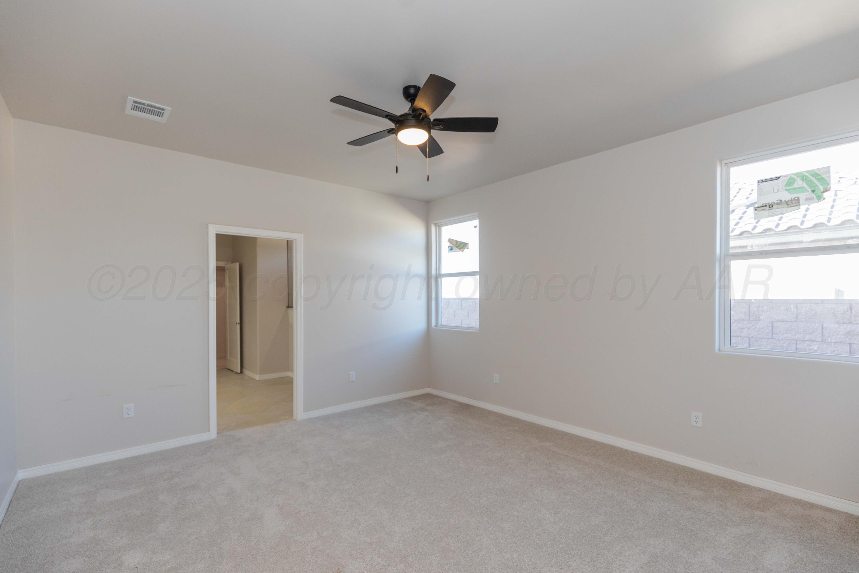 1205 Cabernet Way Amarillo, TX 79124 - Photo 5 of 12 wooden floor in an empty room with a window