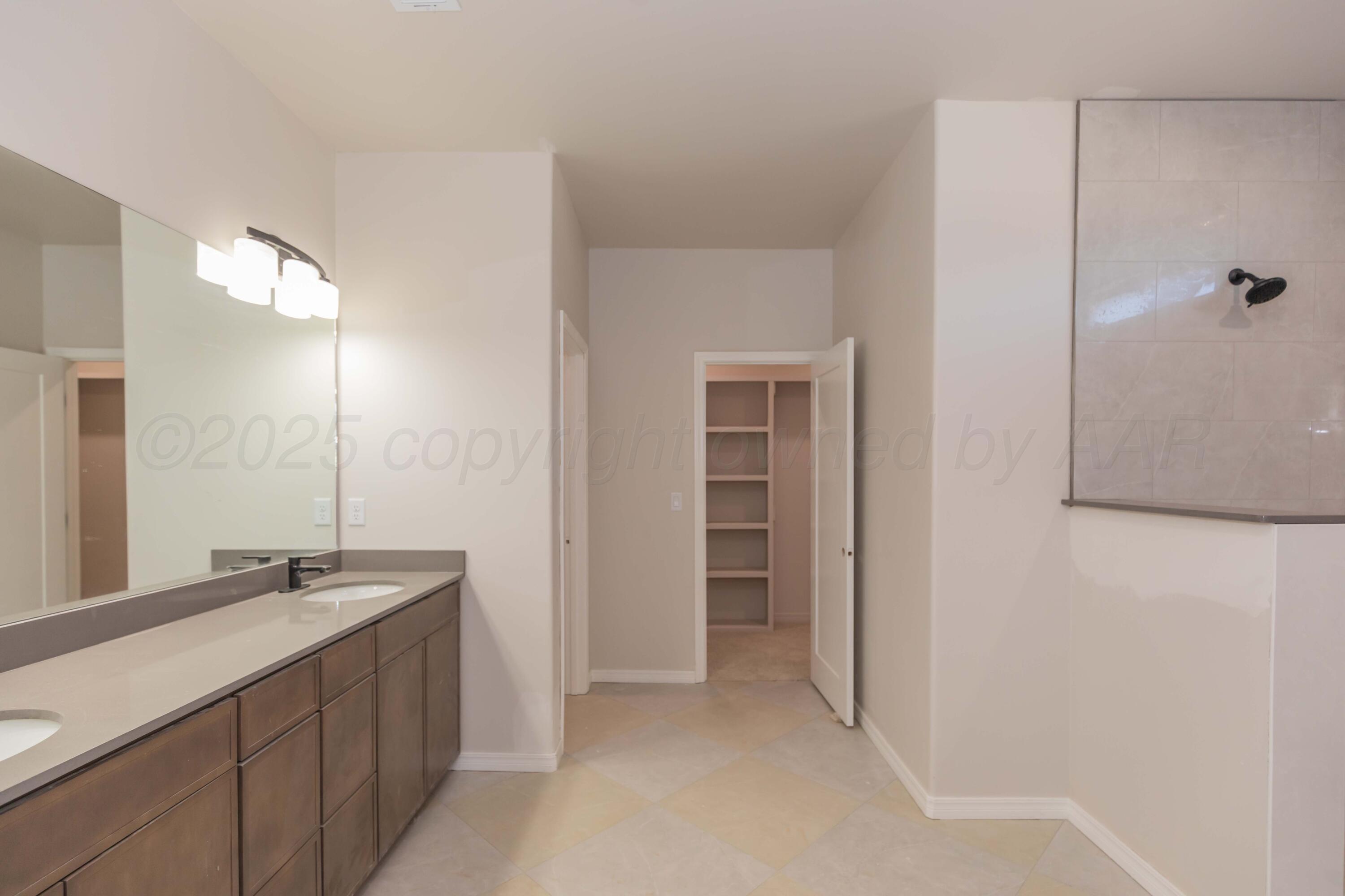1205 Cabernet Way Amarillo, TX 79124 - Photo 6 of 12 a bathroom with a sink and a mirror