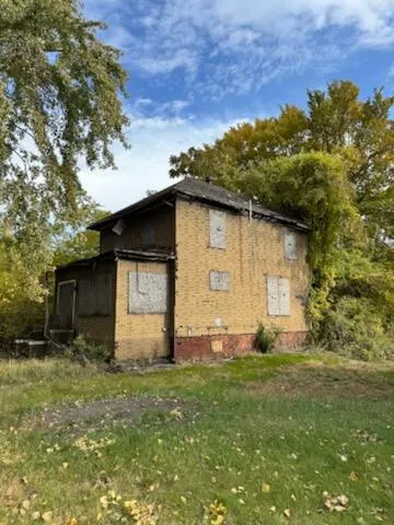 a backyard of a house with lots of green space