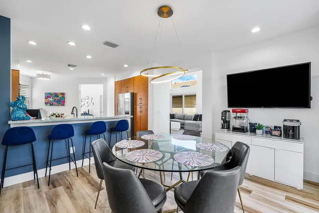 a room with furniture and flat screen tv