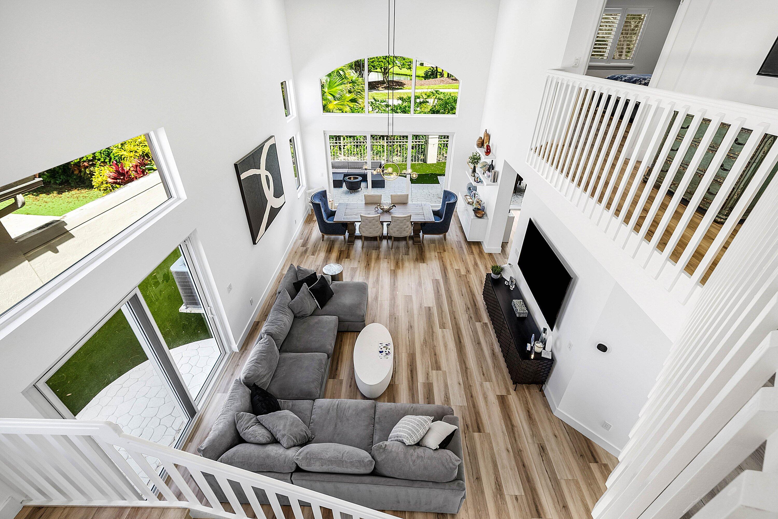 5338 Northwest 26th Circle Boca Raton, FL 33496 - Photo 23 of 68 a living room with furniture and a large window