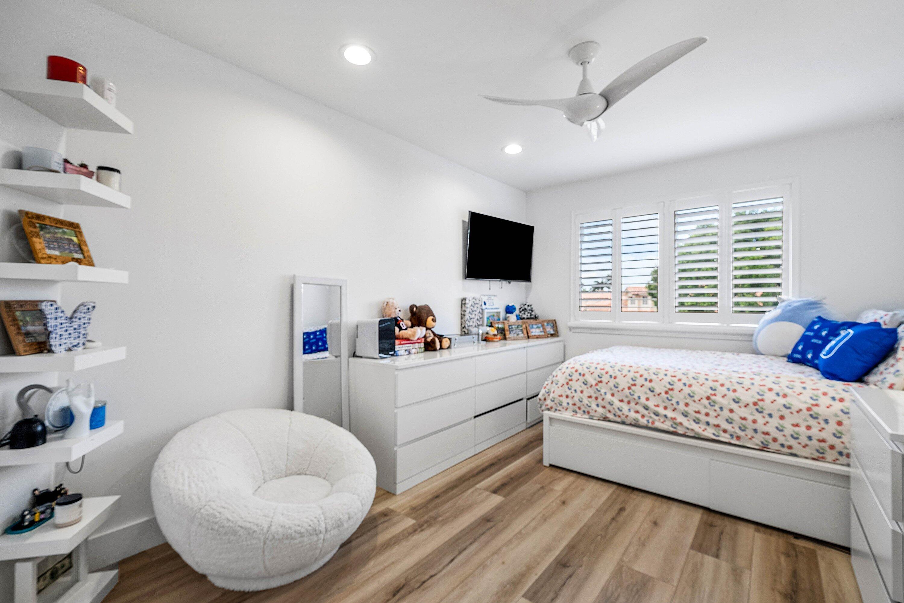 5338 Northwest 26th Circle Boca Raton, FL 33496 - Photo 27 of 68 a bedroom with a bed and a window