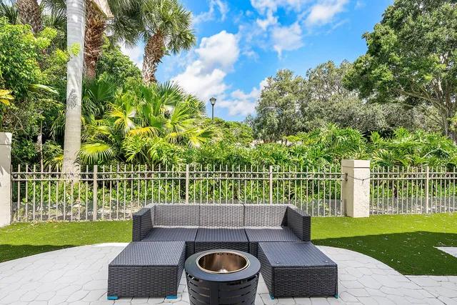 a front view of a house with a yard table and chairs