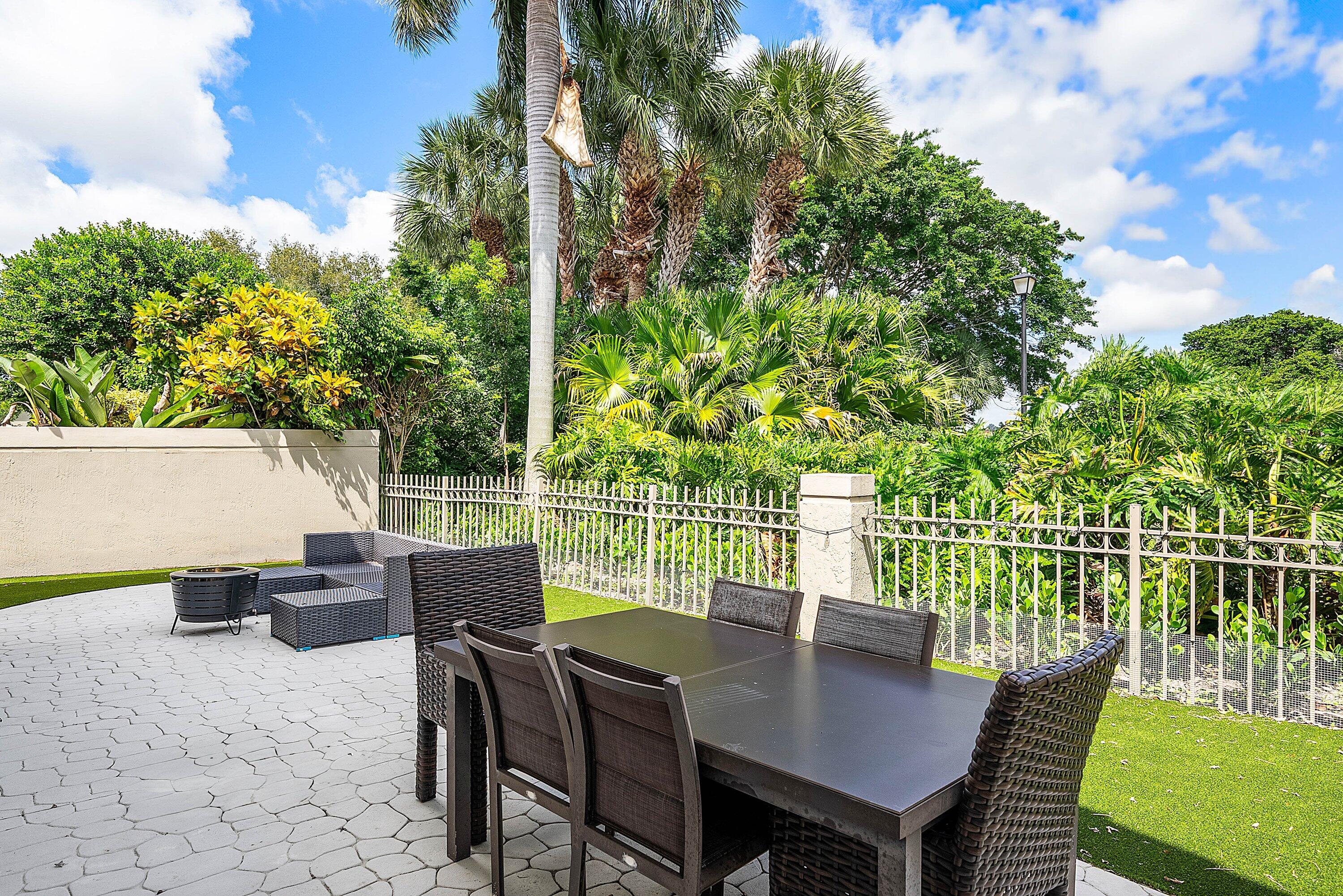 5338 Northwest 26th Circle Boca Raton, FL 33496 - Photo 32 of 68 a view of a dining room with furniture and a potted plant