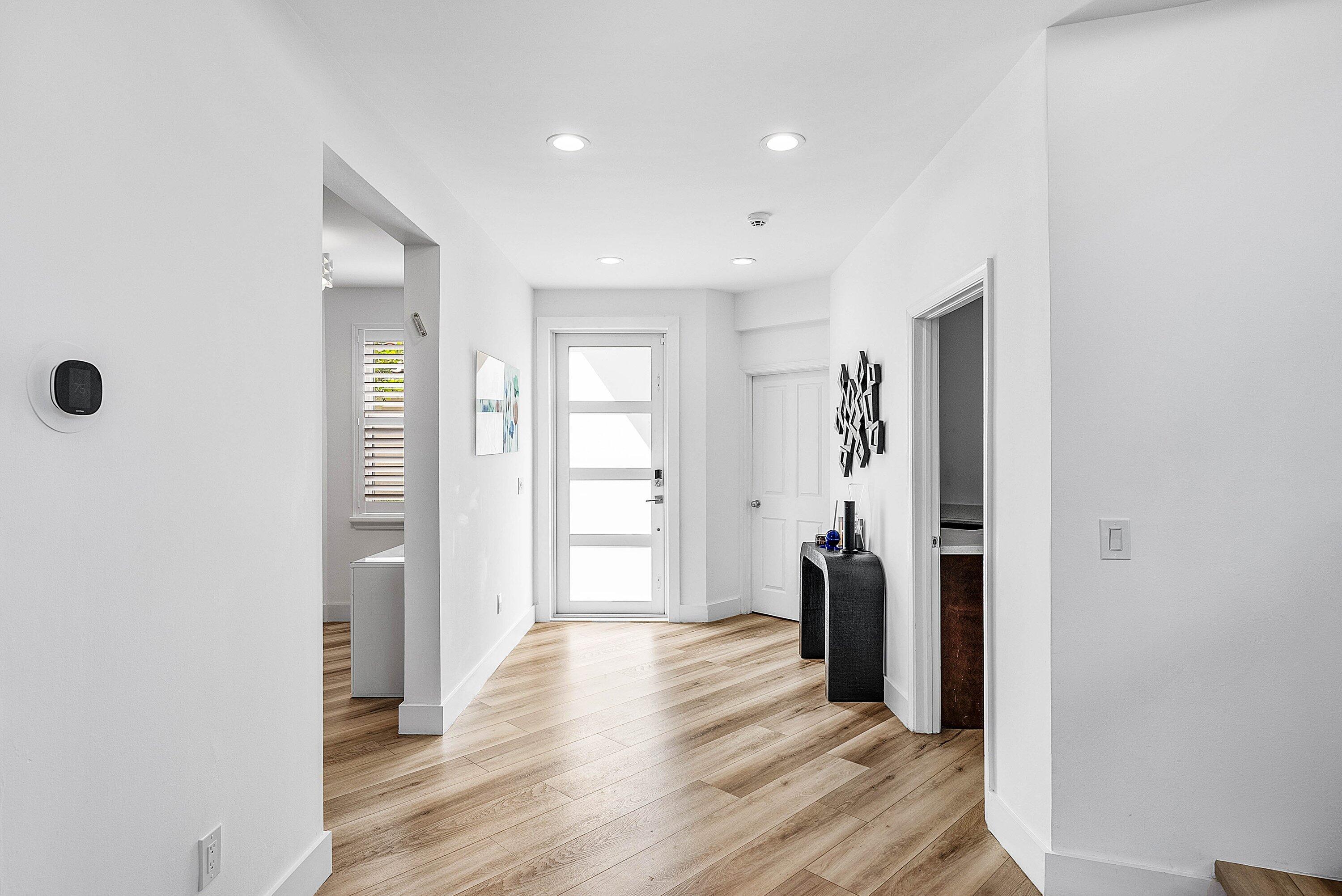 5338 Northwest 26th Circle Boca Raton, FL 33496 - Photo 5 of 68 a view of a hallway with wooden floor and closet
