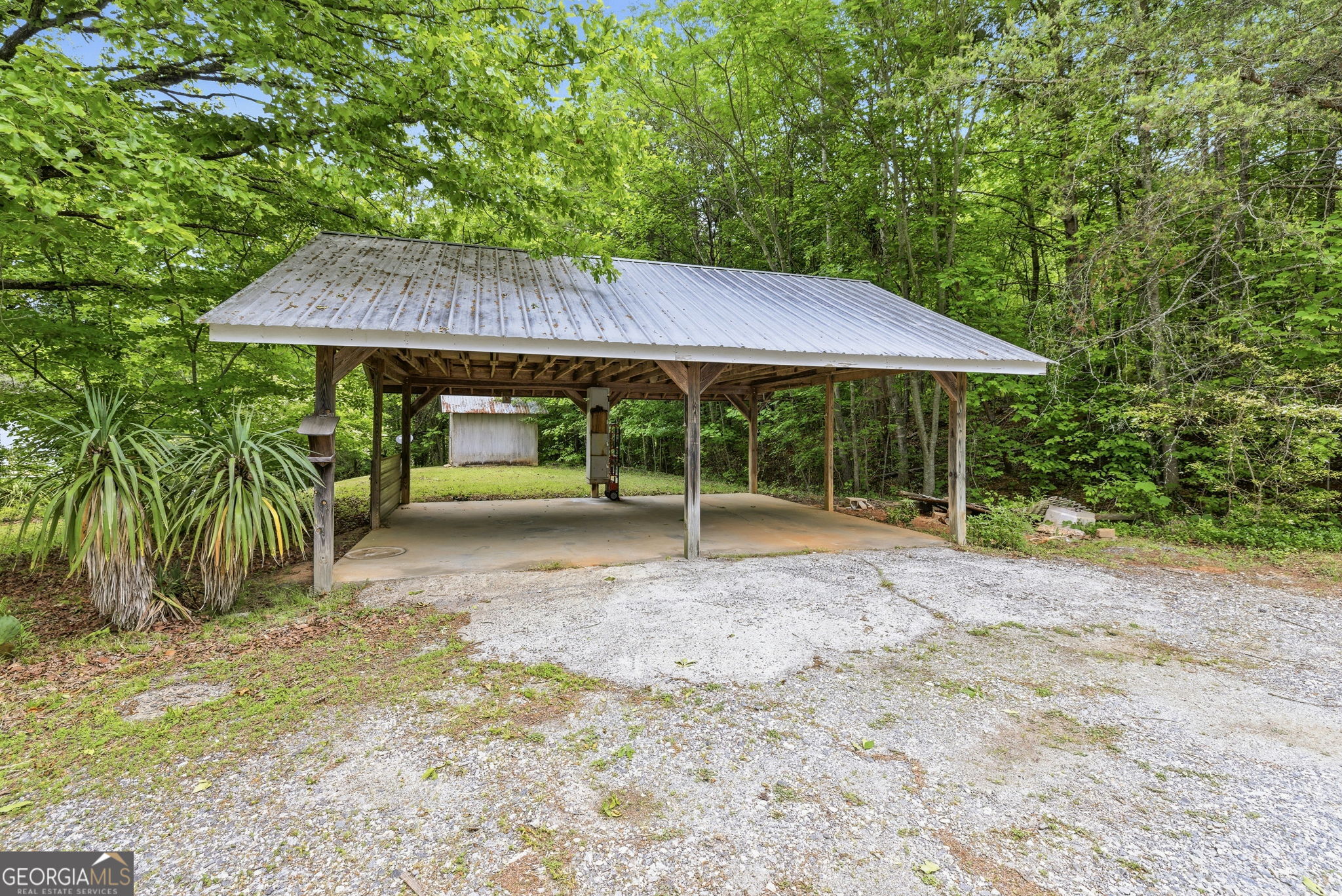 210 Kentucky Street Demorest, GA 30535 - Photo 30 of 30 a backyard of a house with table and chairs