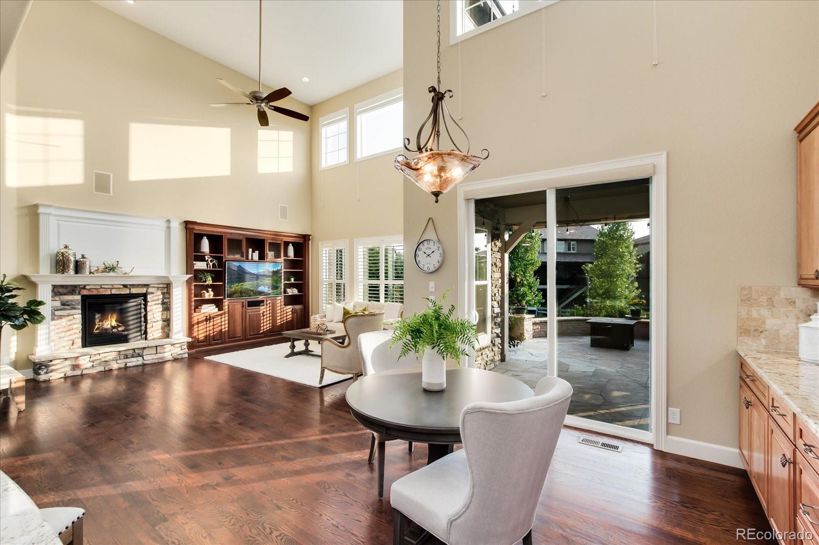 470 Maplehurst Drive Highlands Ranch, CO 80126 - Photo 16 of 40 a dining room with furniture window and wooden floor