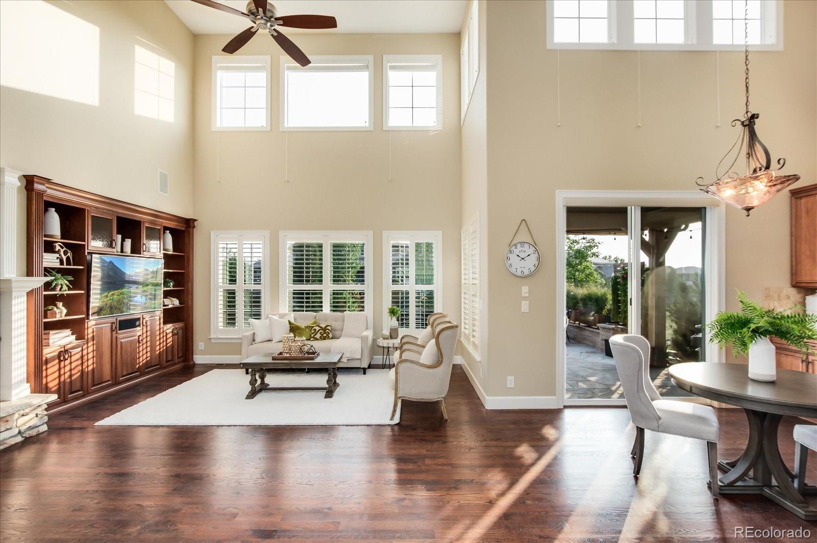 470 Maplehurst Drive Highlands Ranch, CO 80126 - Photo 17 of 40 a living room with furniture and a large window with wooden floor