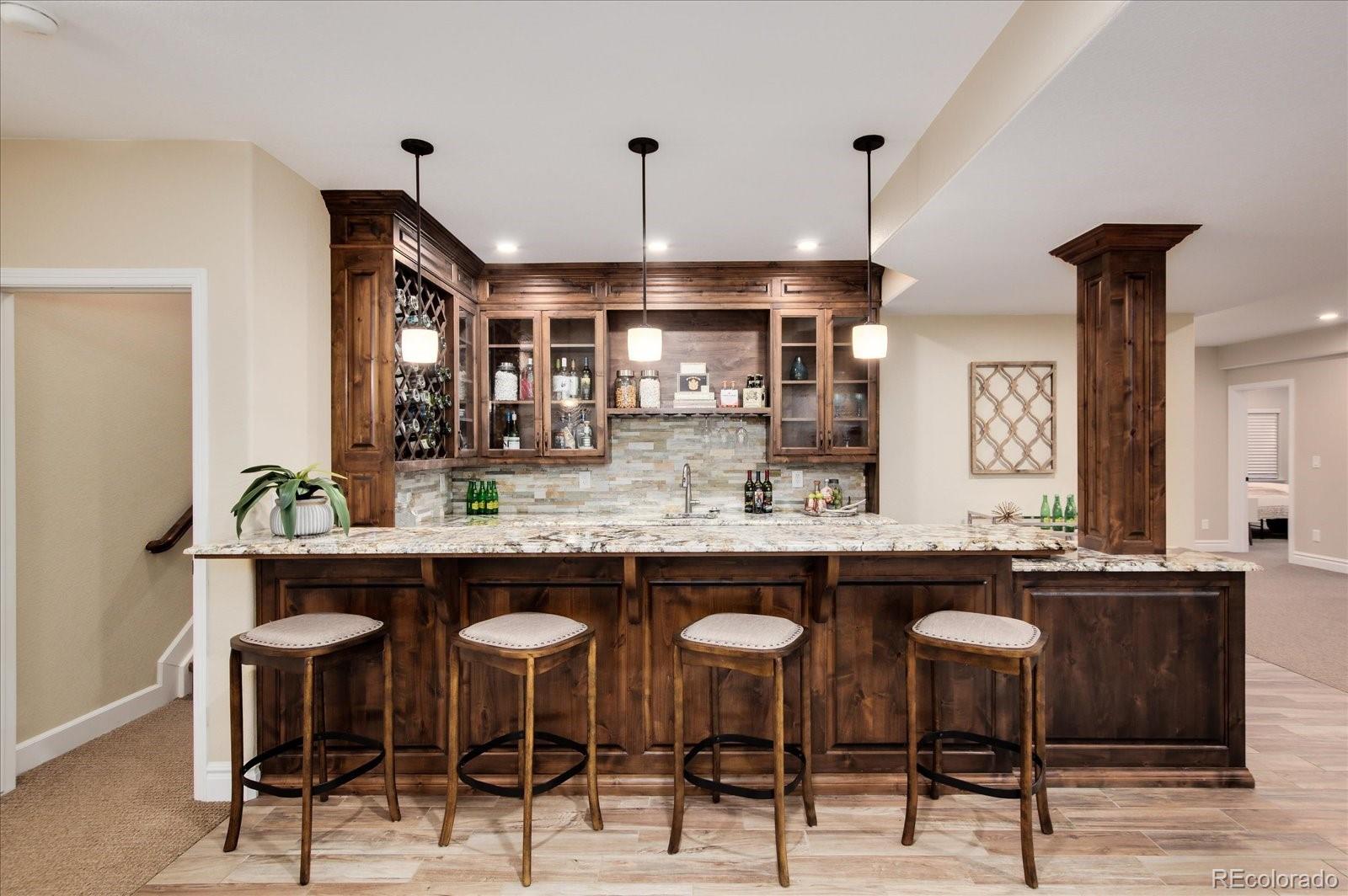 470 Maplehurst Drive Highlands Ranch, CO 80126 - Photo 27 of 40 a kitchen with a table and chairs in it