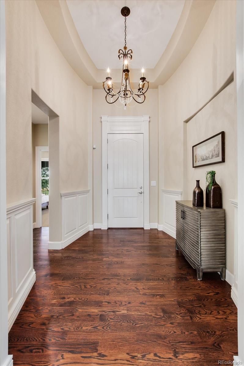 470 Maplehurst Drive Highlands Ranch, CO 80126 - Photo 3 of 40 a living room with furniture chandelier and a window