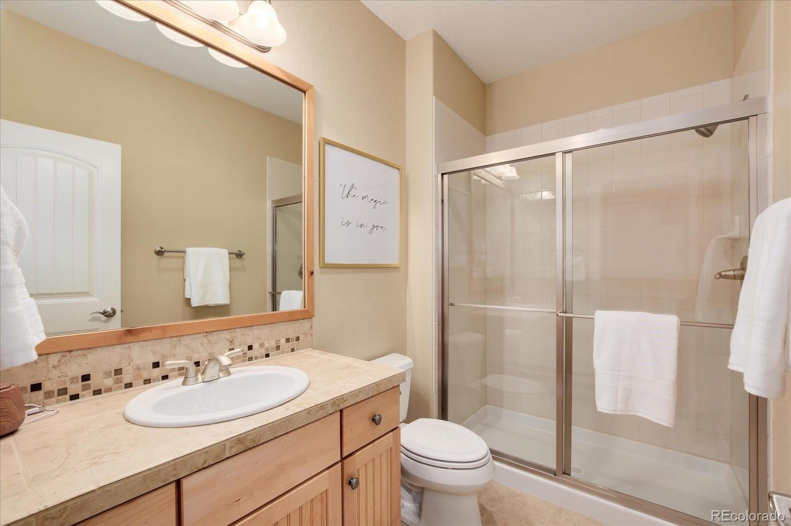 470 Maplehurst Drive Highlands Ranch, CO 80126 - Photo 33 of 40 a bathroom with a sink toilet and shower