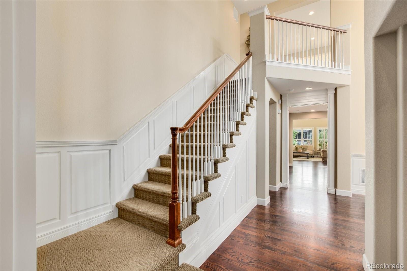 470 Maplehurst Drive Highlands Ranch, CO 80126 - Photo 4 of 40 a view of a hallway with wooden floor and entryway