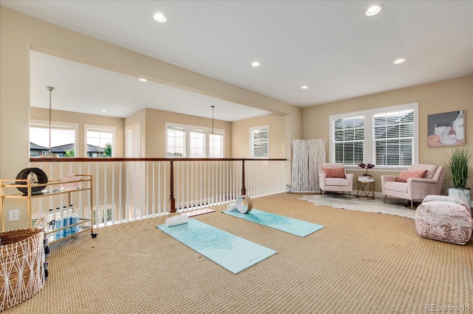 470 Maplehurst Drive Highlands Ranch, CO 80126 - Photo 6 of 40 a spacious bedroom with a bed couch and a window