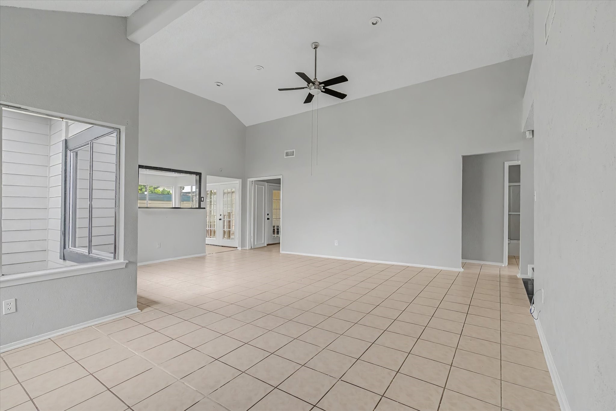 7330 South Dairy Ashford Road Houston, TX 77072 - Photo 8 of 33 an empty room with windows and cabinet