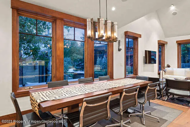 a view of a dining room with furniture window and wooden floor