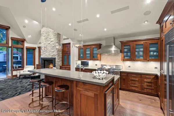 a open kitchen with stainless steel appliances granite countertop a stove and a sink