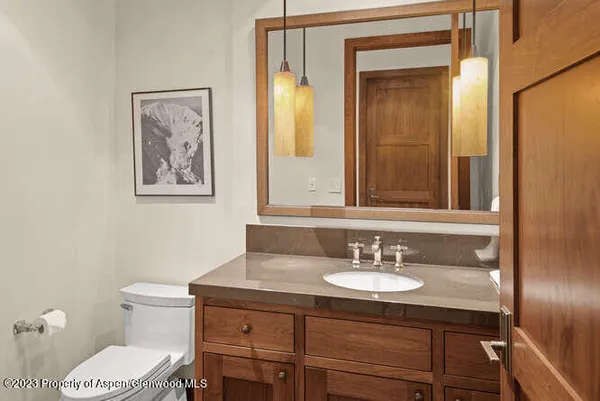 a bathroom with a sink double vanity mirror and a bathtub