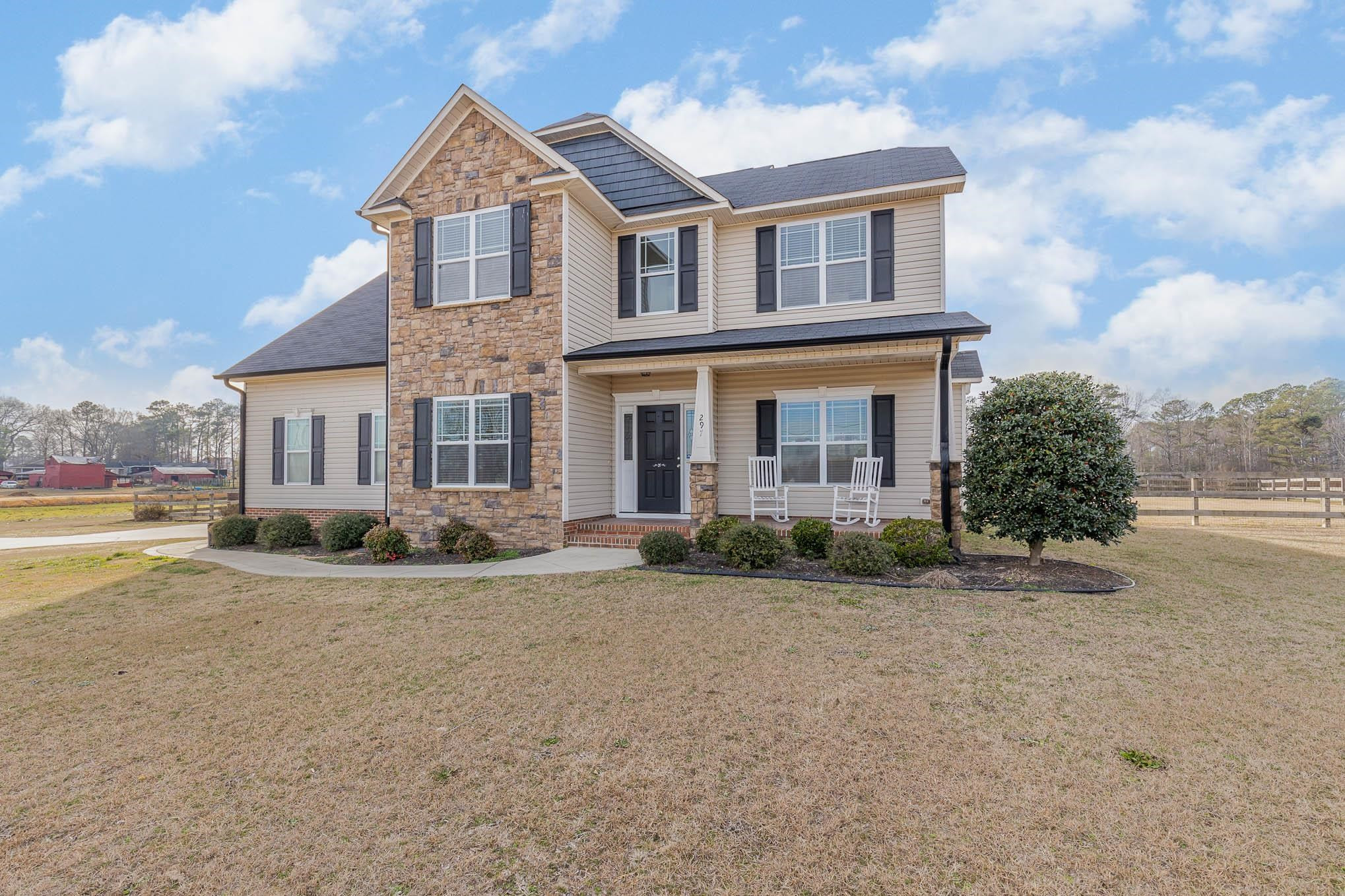 297 Stancil Road Angier, NC 27501 - Photo 2 of 35 a front view of a house with a yard