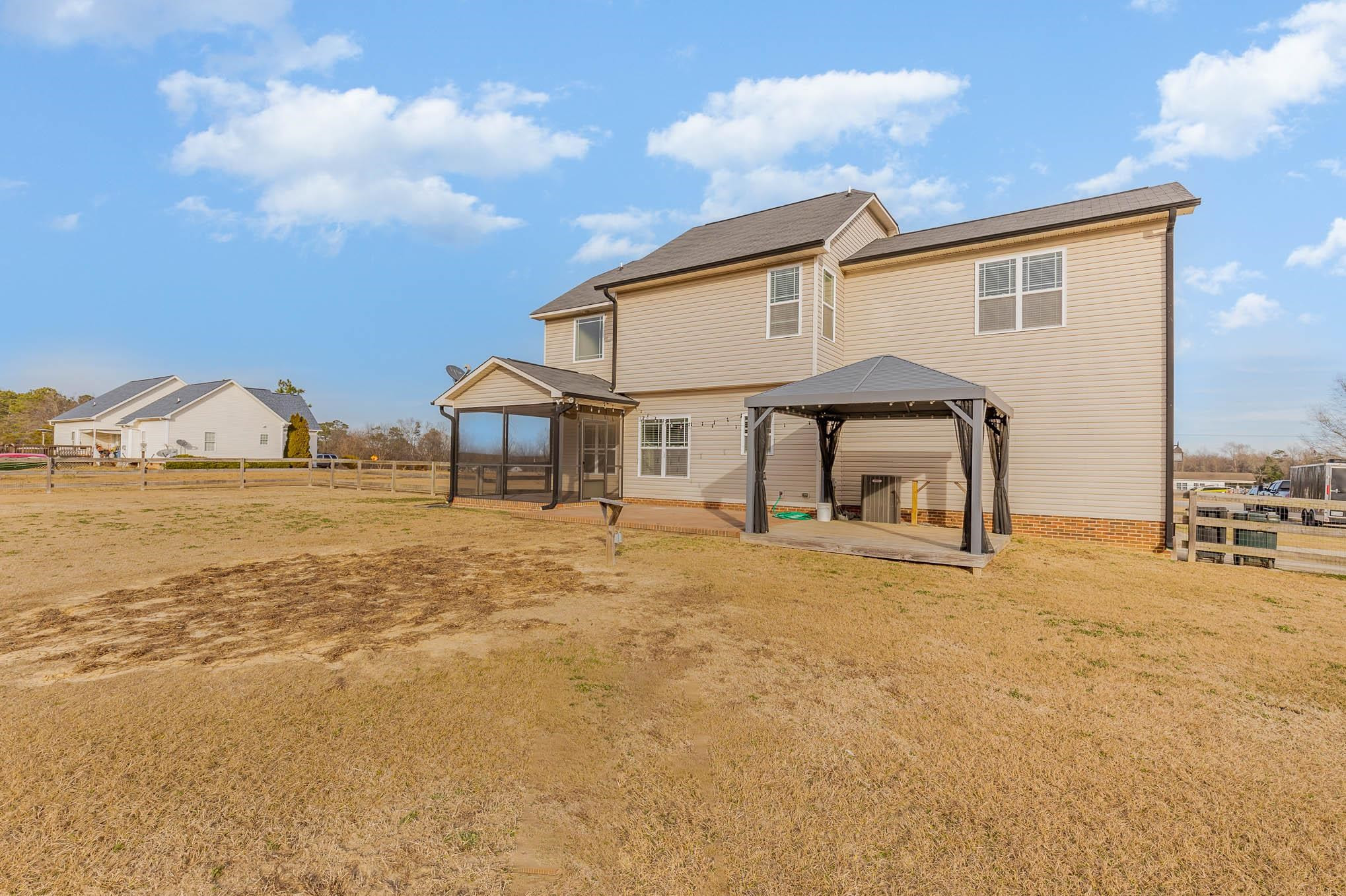 297 Stancil Road Angier, NC 27501 - Photo 31 of 35 a view of a house with backyard and sitting area