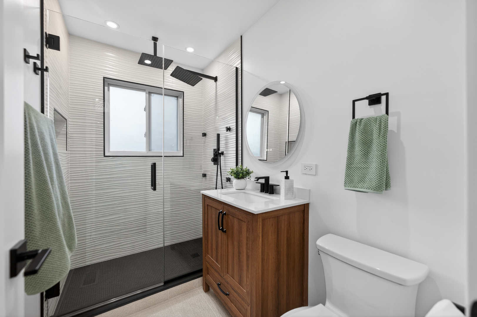 241 East Schick Road Bloomingdale, IL 60108 - Photo 14 of 30 a bathroom with a toilet sink and mirror