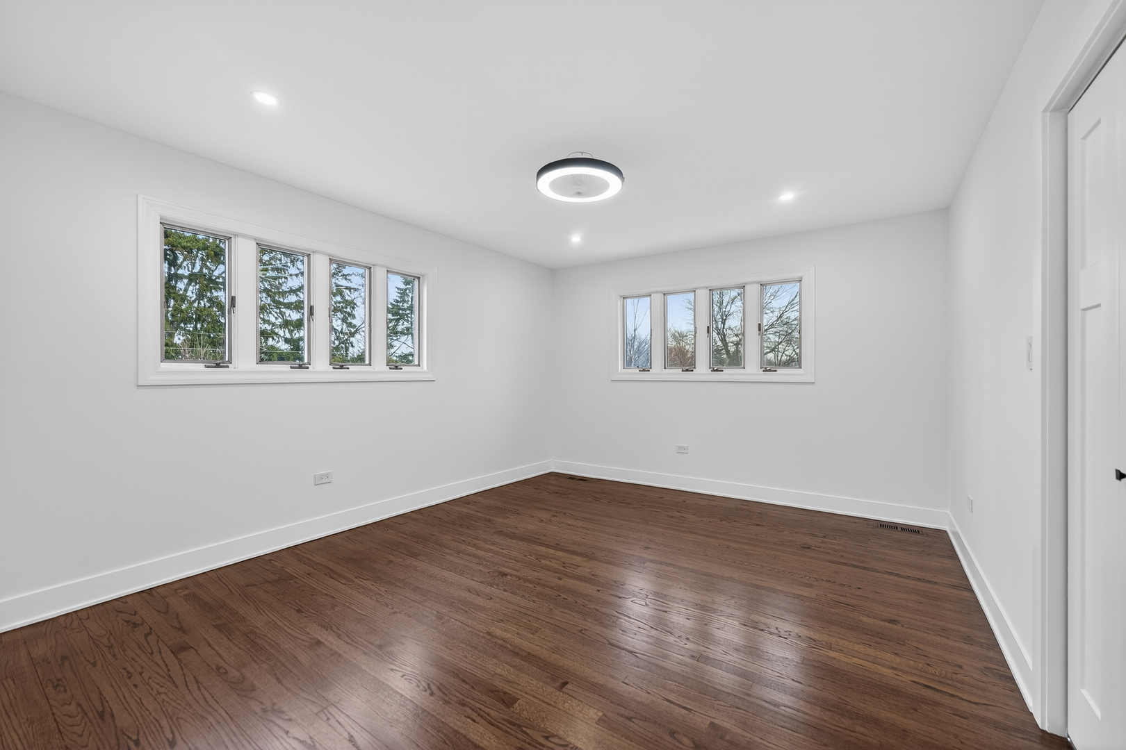 241 East Schick Road Bloomingdale, IL 60108 - Photo 15 of 30 an empty room with wooden floor and windows
