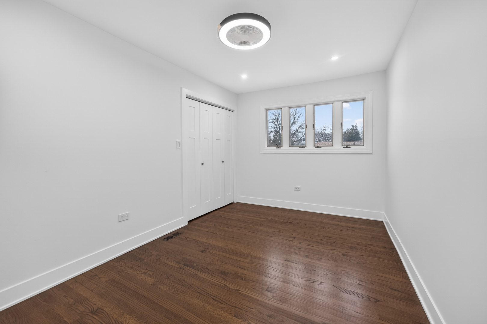 241 East Schick Road Bloomingdale, IL 60108 - Photo 17 of 30 an empty room with wooden floor and windows